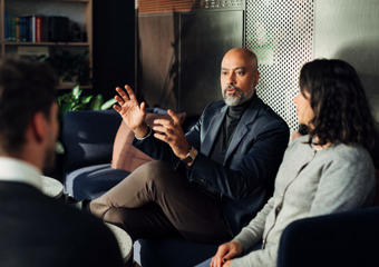 Man in front of monitors